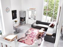 Huonekorkeus ja isot ikkunat tuovat valoa ja avaruutta.