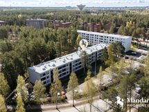 Ilmakuvaa alakyläntieltä päin. Puiden takana näkyisi S-Market Puolivälikangas.