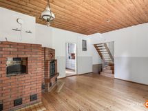 Makuuhuone/ruokailusali, jossa leivinuuni