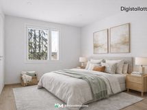 Keskikerrokseen stailattu makuuhuone.