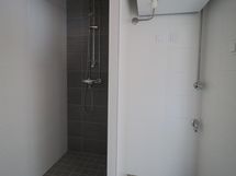 suihkutila ja pesutornin paikka