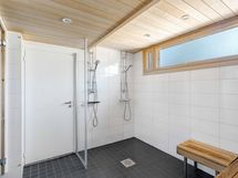 Taloyhtiön saunaosaston pesuhuone