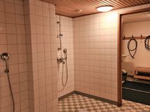 Taloyhtiön yhden saunan pesuhuone