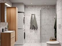 Visualisointi hintaan kuuluvasta kylpyhuonetyylistä Kivinen Huurre. Kivinen Huurre -tyylin kuvioidut lattialaatat (visualisoinnista poiketen 10x10 cm) ja seinälaatat muistuttavat harmaata rantakalliota. Tyyliin sopivat valkotamminen allaslaatikosto, pyykkikaappi, peilikaappi sekä sähkökäyttöinen pyyhekuivain. M-koon kylpyhuoneeseen mahtuu myös pesutorni, kun taas S-koon kylpyhuoneeseen ei mahdu pesutornia, vaan esim. kuivaava pesukone.