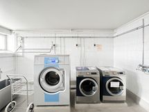 Taloyhtiön maksuton pesutupa.